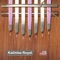 The Kalimba is an African musical instrument consisting of a wooden board (often fitted with a resonator) with attached staggered metal tines, played by holding the instrument in the hands and plucking the tines with the thumbs